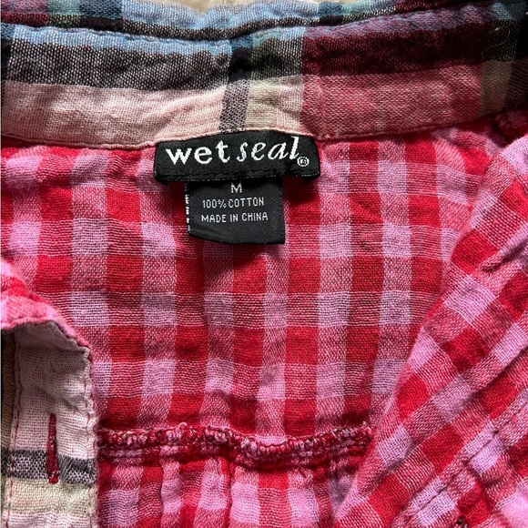 It’s from wet seal and is a pink plaid button up shirt in a size medium - Picture 2 of 2